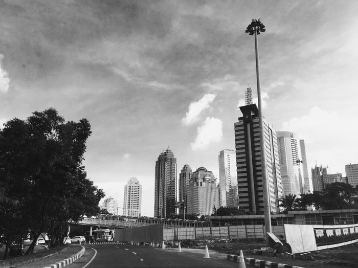 City street against cloudy sky