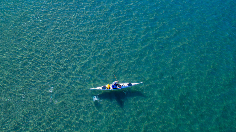 High angle view of man kayaking in sea