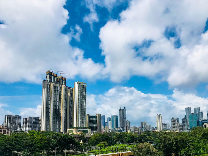 Modern buildings in city against sky