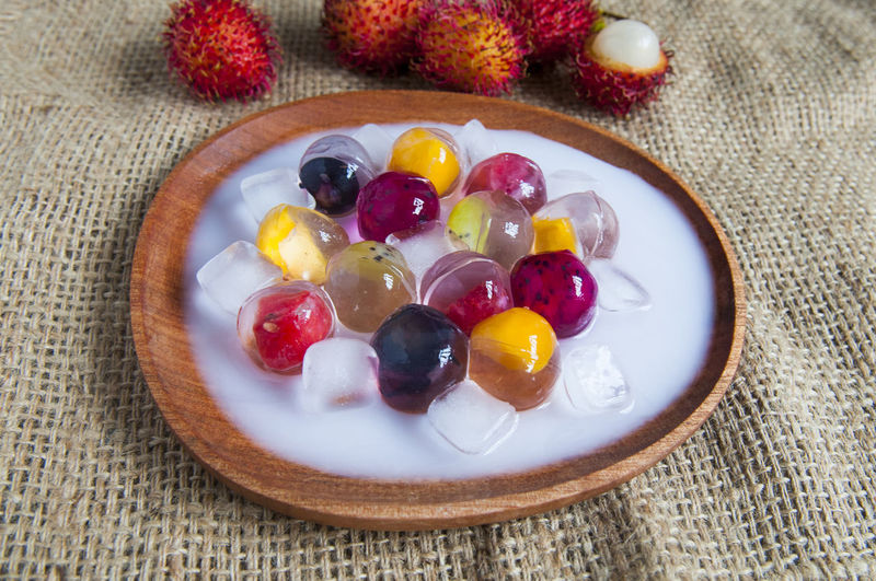 High angle view of fruit jelly dessert served in plate on table