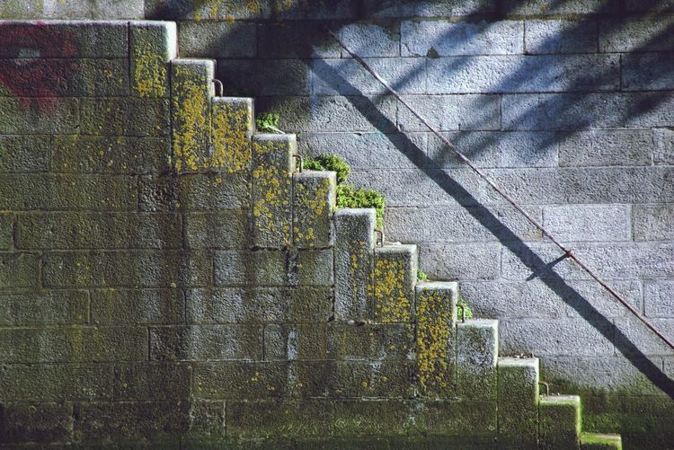 Empty steps by wall