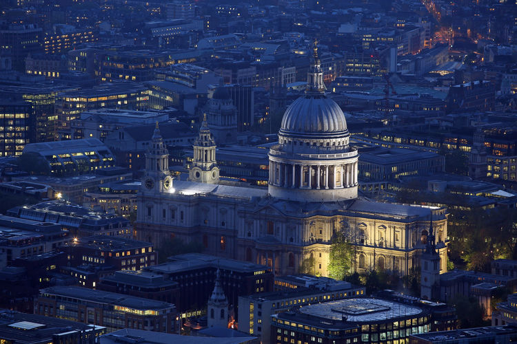 High angle view of illuminated st paul cathedral amidst city at night