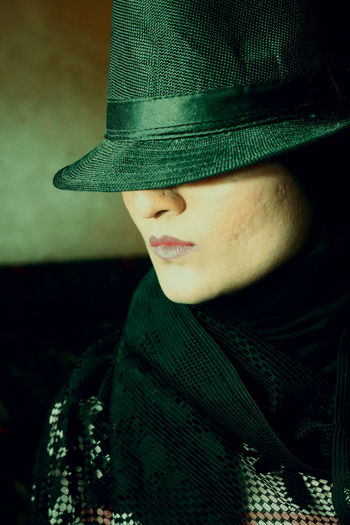 Portrait of young woman in hat
