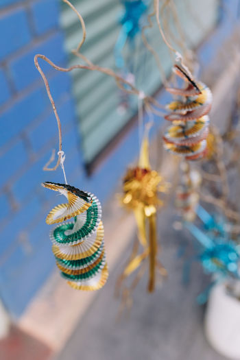 High angle view of colorful christmas ornament hanging from a branch