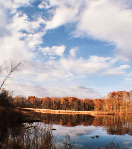 Scenic view of lake against sky during winter