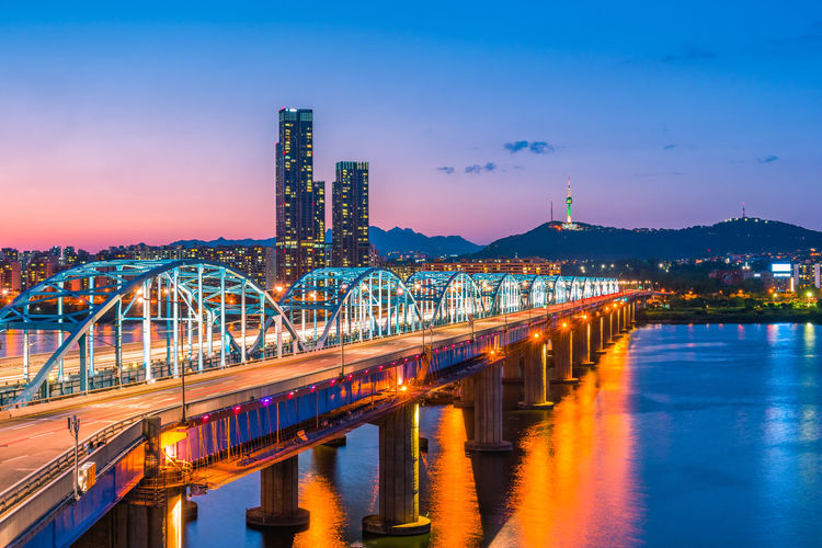 Illuminated bridge at night