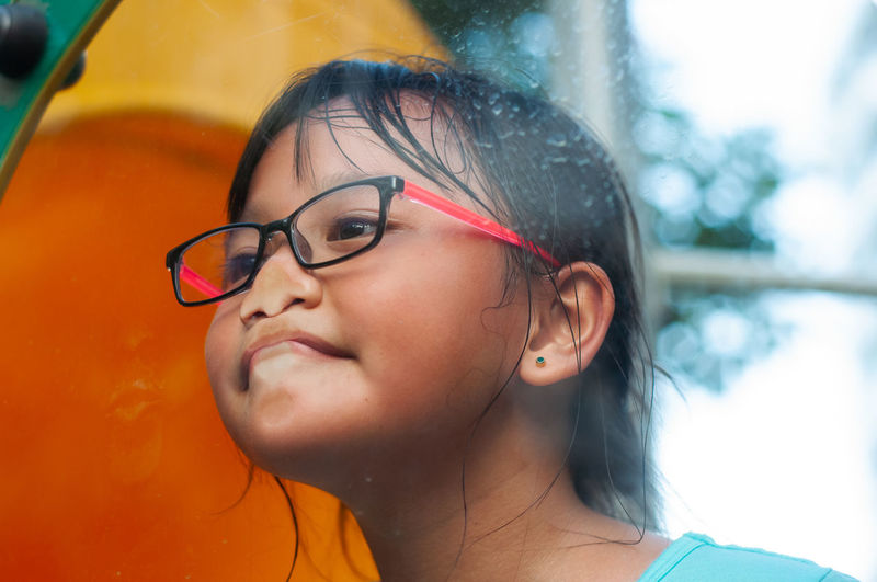 Close-up of girl playing on ground
