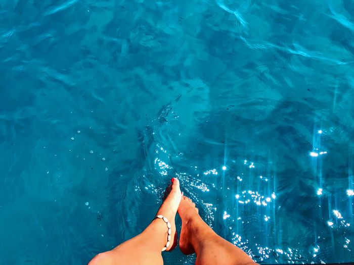 Low section of woman in swimming pool