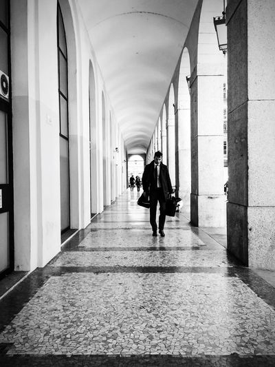 People walking in corridor