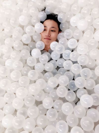 High angle view of woman in ball pool