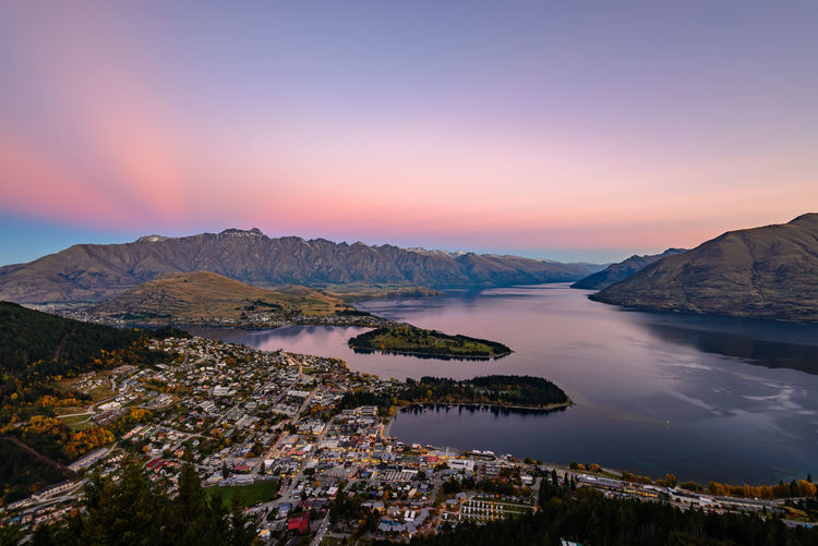 Aerial view of townscape and lake during sunset 