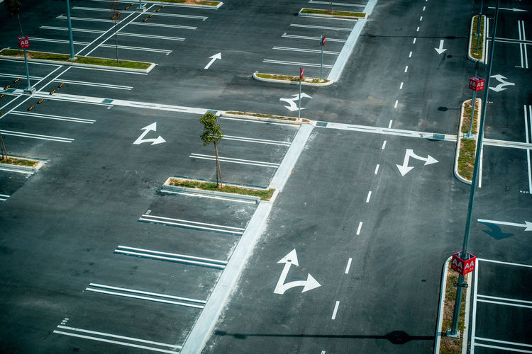 High angle view of arrow symbol on road in city