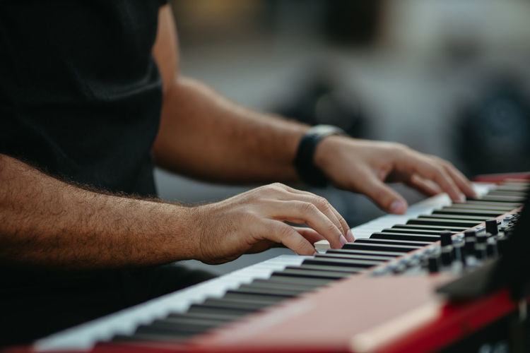Close up man playing piano