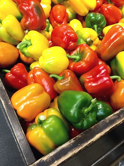 High angle view of bell peppers in crate at store