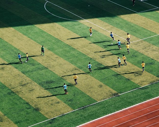 High angle view of soccer player playing on field