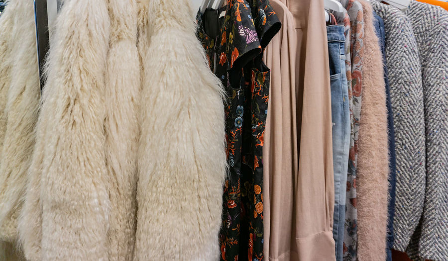Close-up of clothing hanging in store