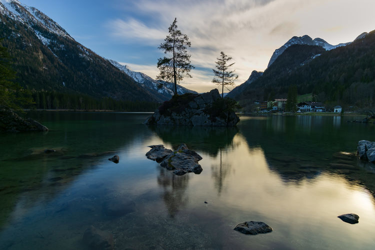 Scenic view of lake and snowcapped mountains against sky