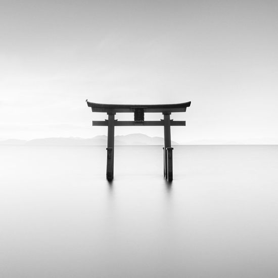 Long exposure shot of shirahige shrine torii gate at sunrise, lake biwa, shiga prefecture, japan