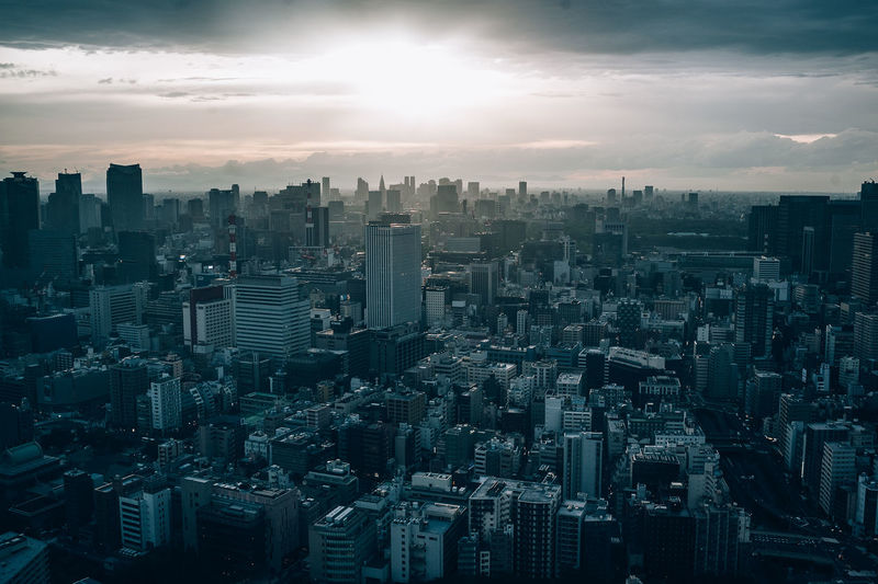 High angle view of modern buildings in city against sky