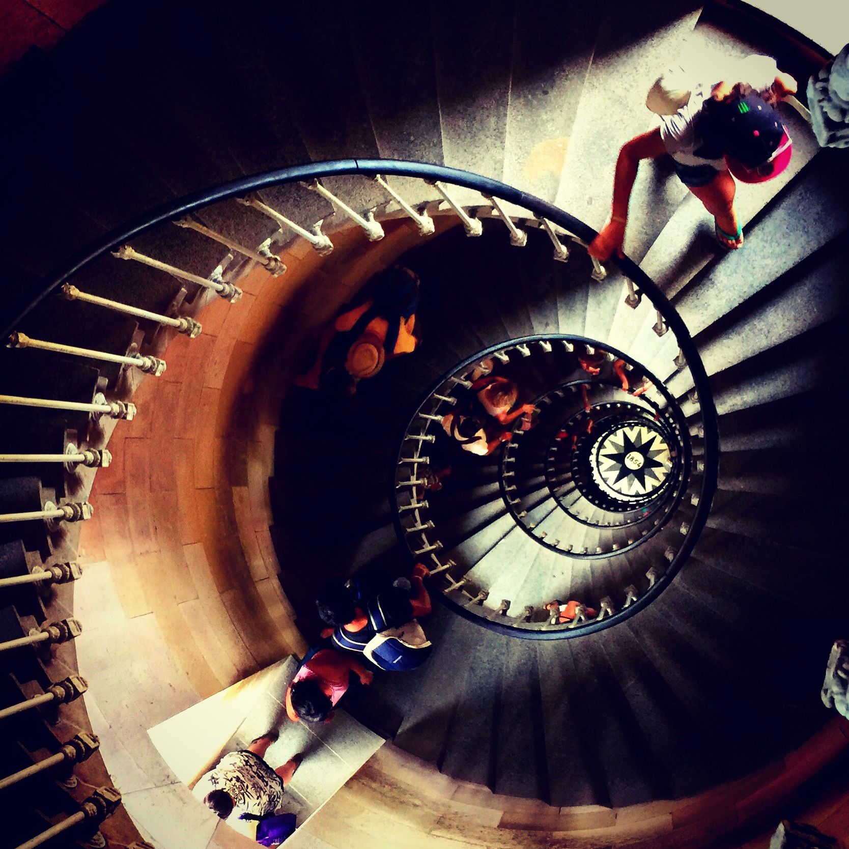 indoors, steps and staircases, staircase, technology, steps, spiral staircase, spiral, high angle view, circle, railing, illuminated, arts culture and entertainment, machine part, machinery, metal, built structure, close-up, music, low angle view, photography themes