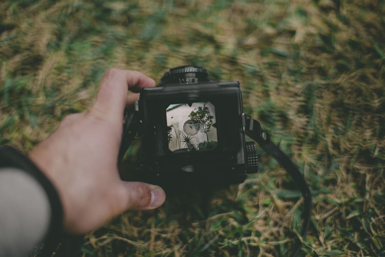 Person photographing through camera
