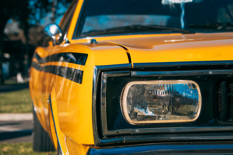 Close-up of yellow retro styled car