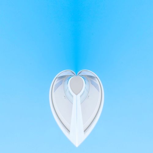 Directly below shot of heart shape against blue background