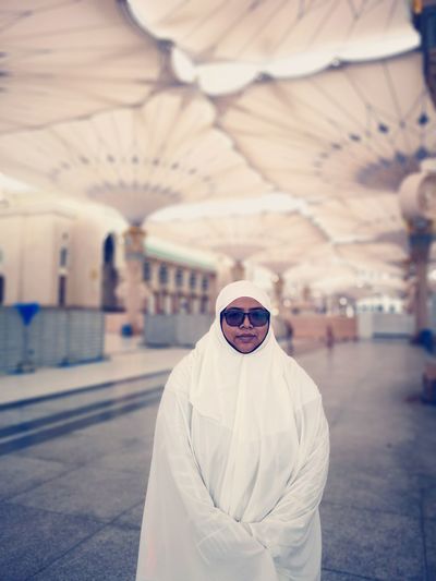 Portrait of woman burka while standing under ceiling