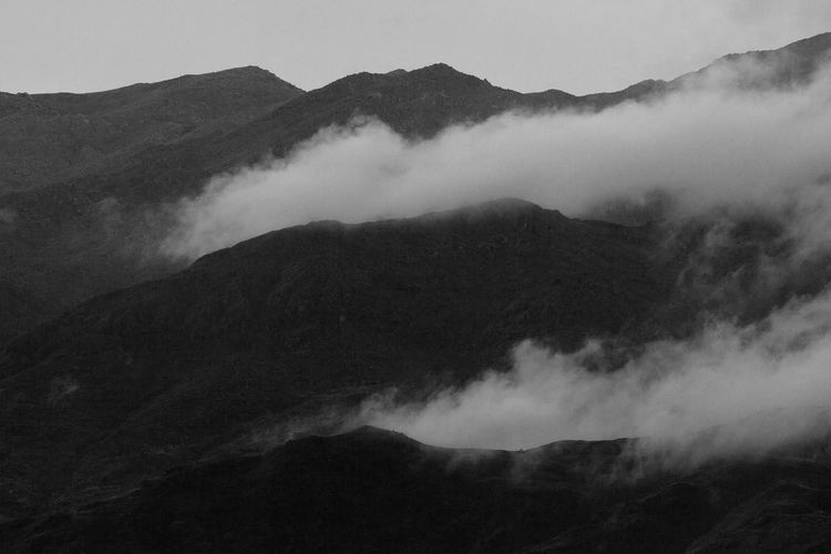Scenic view of mountains in foggy weather