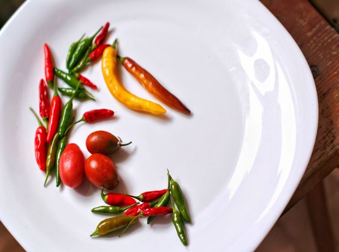 High angle view of fruits in plate on table