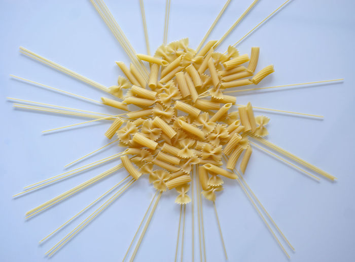 High angle view of pasta against white background