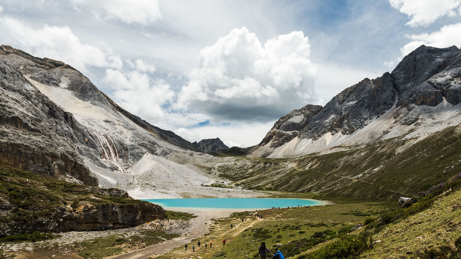 Scenic view of mountains against cloudy sky