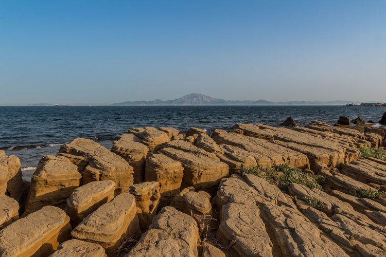 Scenic view of sea against clear sky