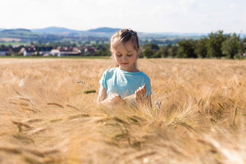 The concept of freedom and unity with nature. summer vacation. relaxation. a cute charming girl