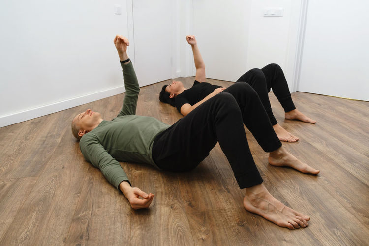 Low section of woman exercising in gym