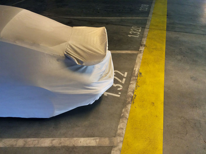 High angle view of covered car on parking lot
