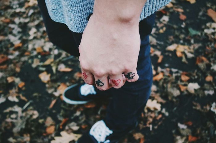 Close-up of fingers with tattoo