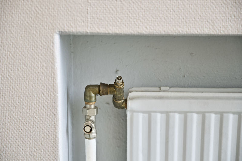 Close-up of radiator against wall