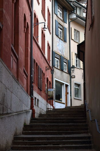 Steps amidst buildings in city