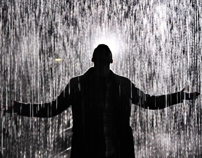 Silhouette man standing in water