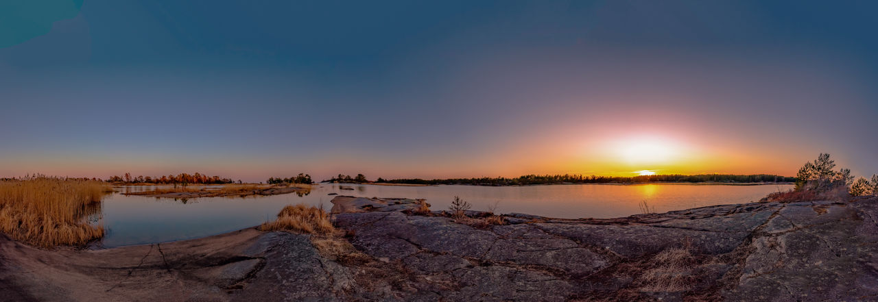Panoramic view of rocks against sky during sunset