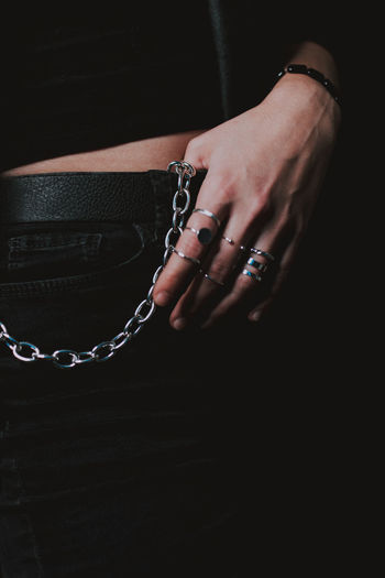 Midsection of woman with chain