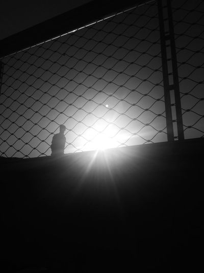 Silhouette of standing on floor against sky