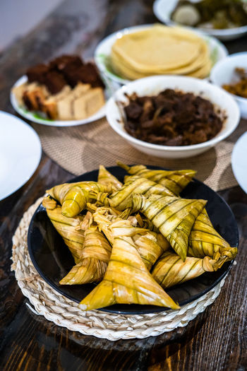Ketupat palas with all traditional malay food and cookies during ramadan and eid mubarak.