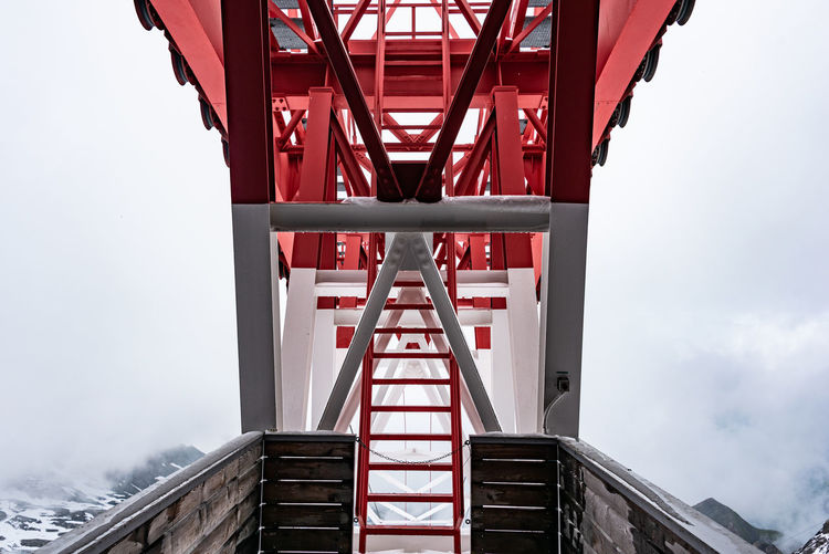 Pylon, red and white painted steel tower, fragments showing details of construction, joins, rivets.