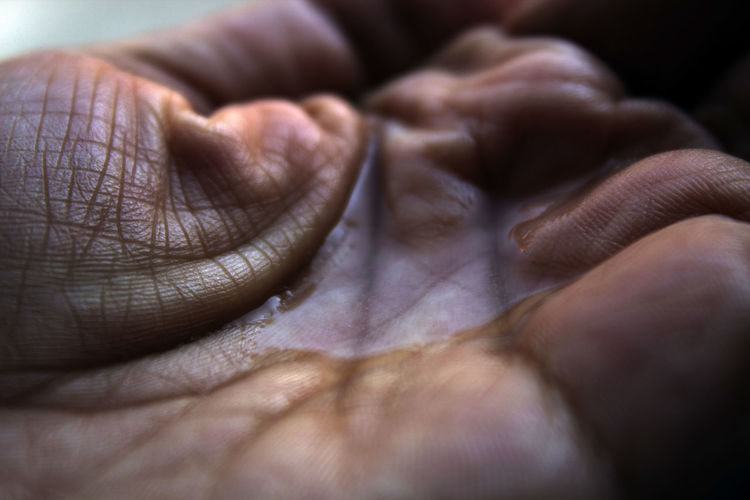 The photo depicts my mom's hand holding water in a macro frame in a photo series named hands stories