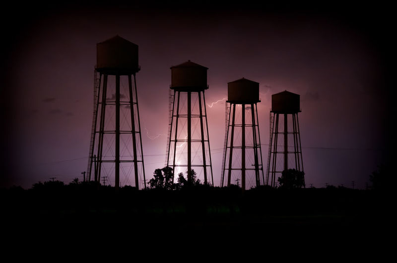 View of water tower against sky during sunset