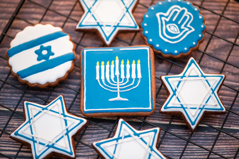 Delicious festive hanukkah cookies for celebrating on a wooden background at home. close-up.
