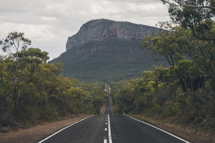 Endless road towards mountains at the grampian national park, victoria, australia