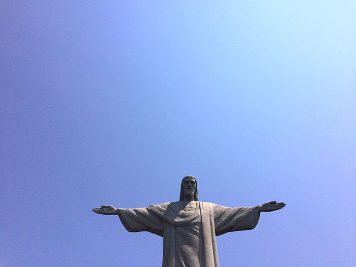 Low angle view of christ the redeemer against clear blue sky